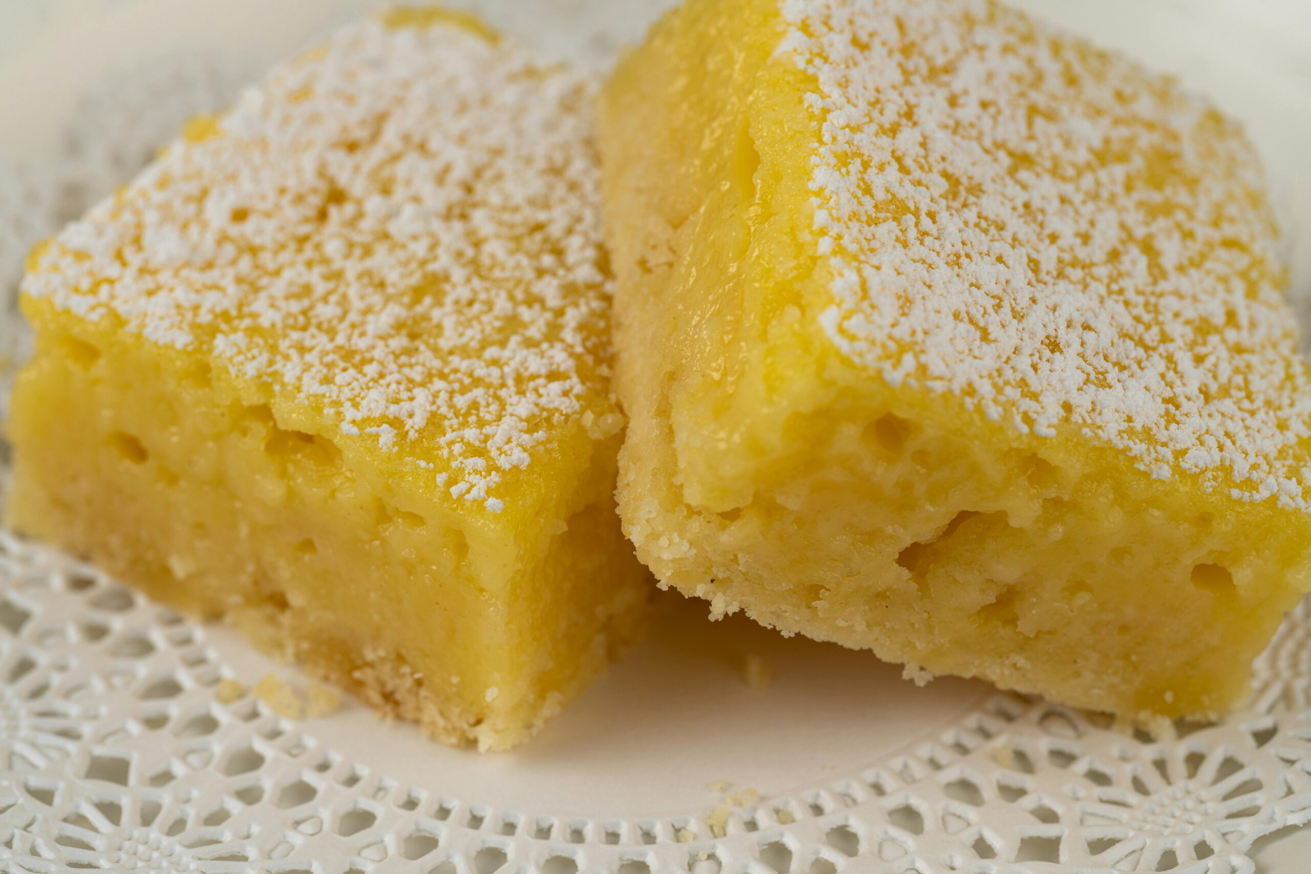Tasty lemon squares dusted with powdered sugar, perfect for dessert.